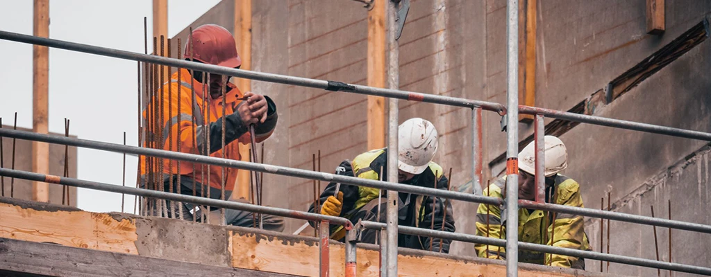 A commercial building contractor and their team work on a building in Long Island